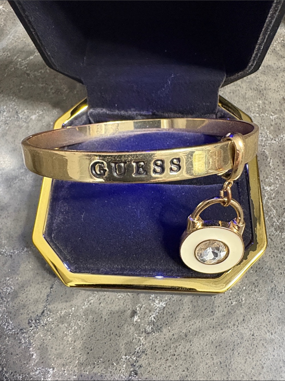 Guess Gold Tone Logo Bangle with Enamel and Crystal Charm